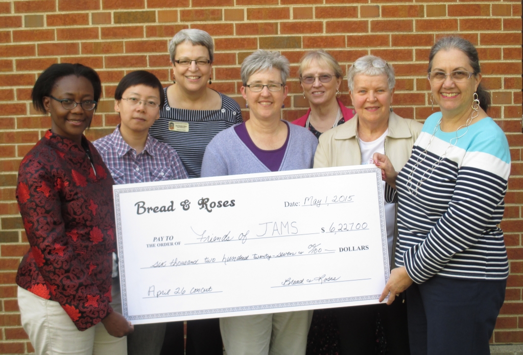 Friends of JAMS receives check from Bread & Roses